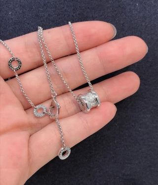 Bvlgari Silver Spiral Circle Pendant Necklace – Elegant Luxury Jewelry