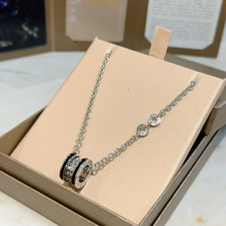 Bvlgari Silver Black Circle Pendant Necklace – Elegant Luxury Jewelry