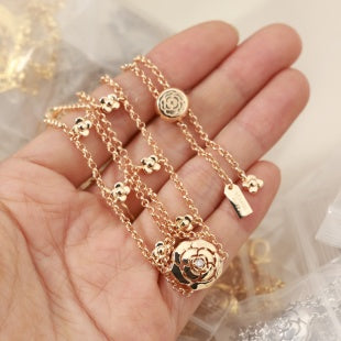 CHANEL Golden Charm Cascade Layered Bracelet